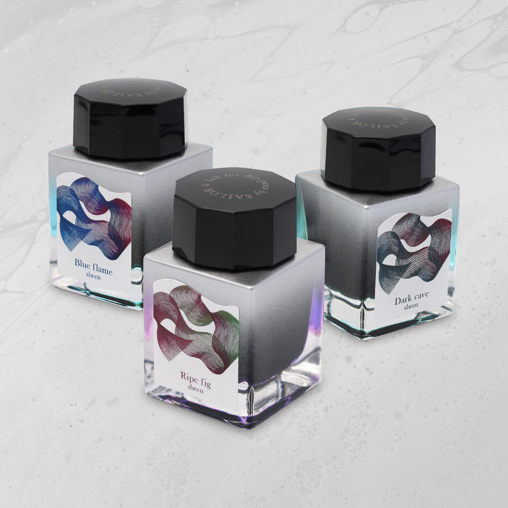 Dipton Ink Dark Cave - 20ml by Sailor, a sheeny dye ink for dip pens, featuring an intricate label design showcasing its vibrant, multicolored sheen.