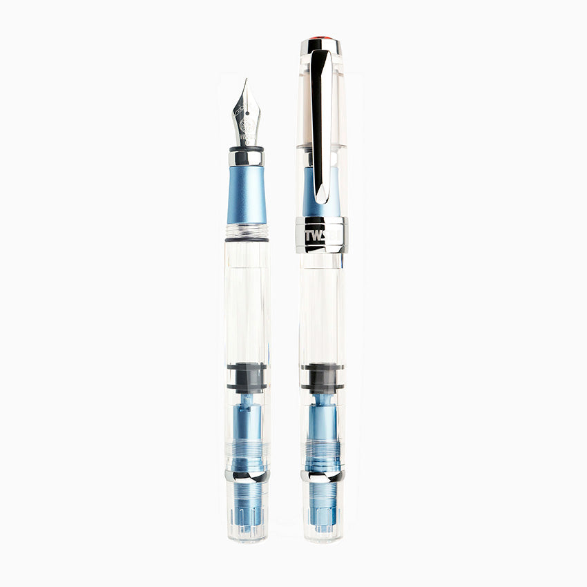 TWSBI Diamond 580 ALR (Iceberg) fountain pen, extra fine nib, clear with light blue accents, showcasing piston-fill mechanism and transparent body.