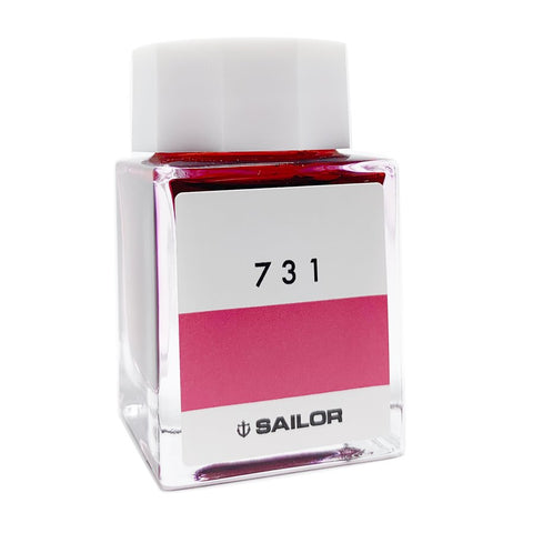 Square glass bottle of Sailor Ink Studio #731, featuring a white cap and a pinkish-red ink swatch on the label, 20ml dye-based ink.