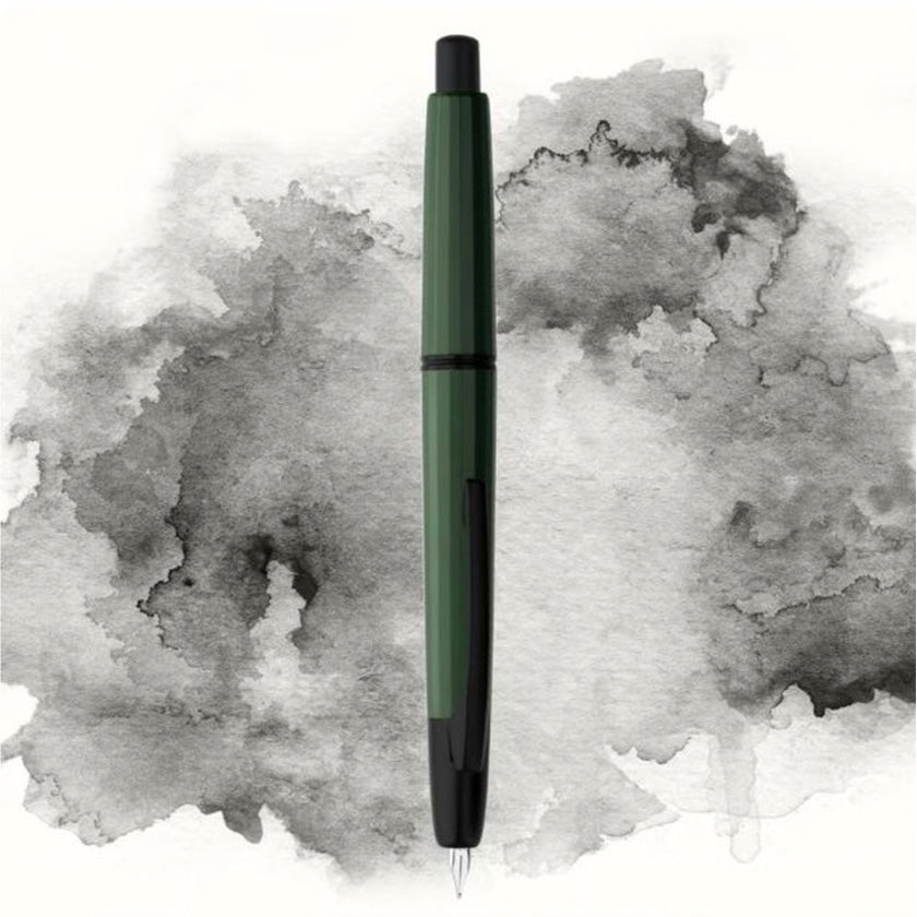 Moonman/Majohn A2 fountain pen, Army Green/Black Clip, Extra Fine nib, shown uncapped with green resin body and matte black accents against a gray background.