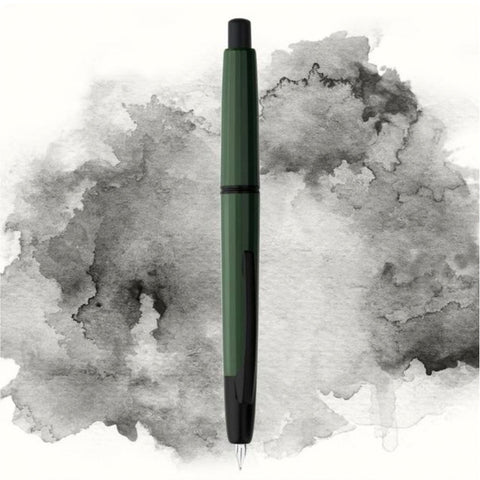 Moonman/Majohn A2 fountain pen, Army Green/Black Clip, Extra Fine nib, shown uncapped with green resin body and matte black accents against a gray background.
