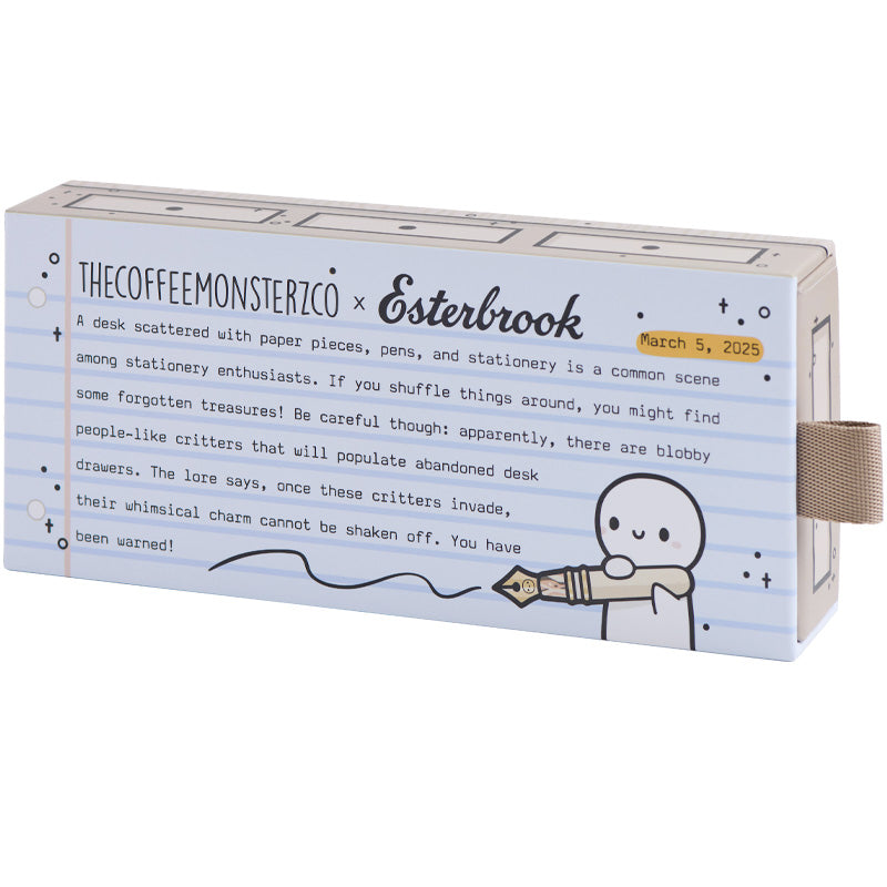Estie - TheCoffeeMonsterzCo Collab / Gold - Extra Fine: A stationery-themed gift box featuring a cartoon critter, designed for storing this collaborative fountain pen with playful resin accents.