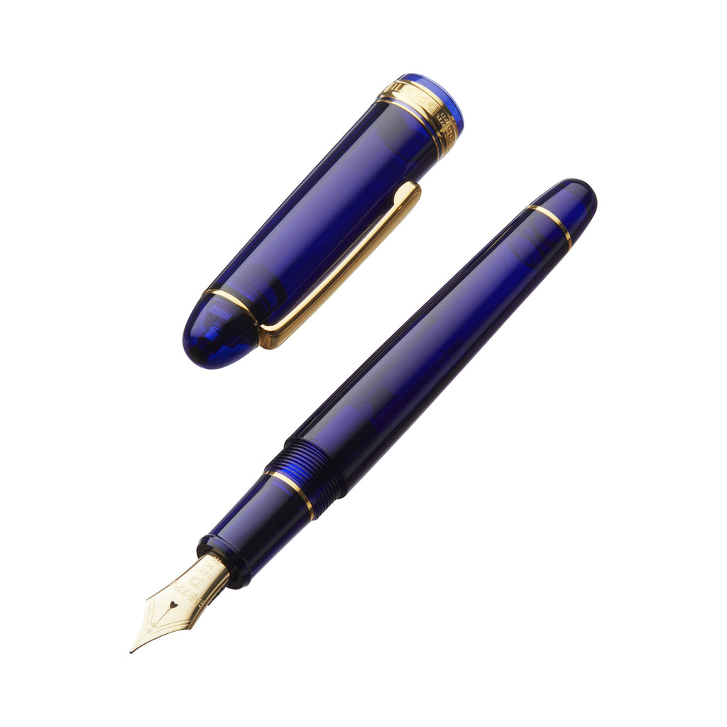Luxury Platinum #3776 Century fountain pen in translucent blue resin with gold-tone trim, uncapped to show gold nib, cap with gold clip beside it.