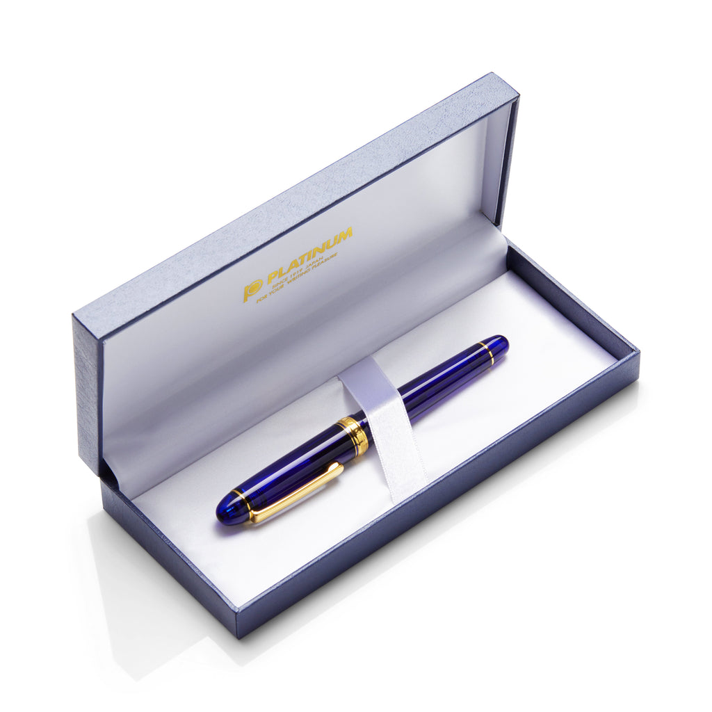 #3776 Century - Chartres Blue - Extra Fine fountain pen in a white satin-lined presentation box with Platinum logo, showcasing blue-and-gold design and 14k gold nib.
