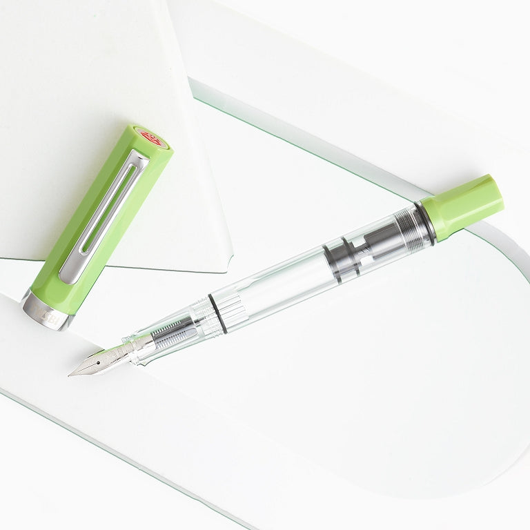 TWSBI ECO fountain pen in Matcha. Green and clear pen on a white background