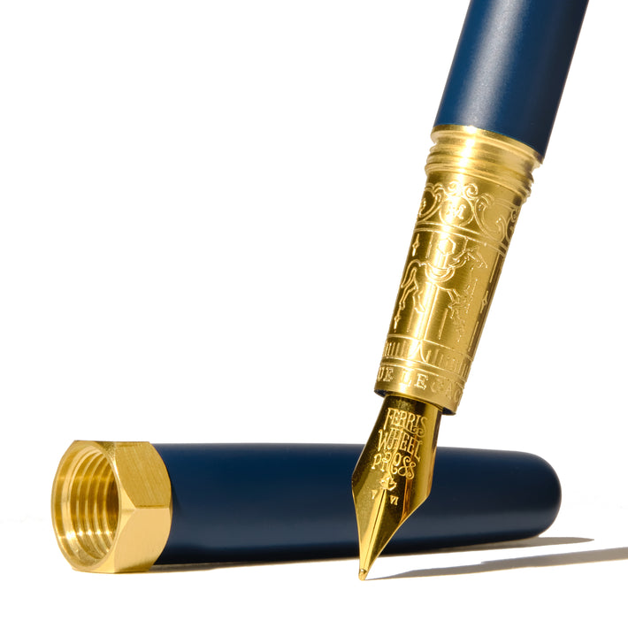 Ferris Wheel Press Brush Fountain Pen - Blue Legacy Satin Series, featuring a fine 14k gold nib, elegant blue barrel, and matching cap with gold accents.