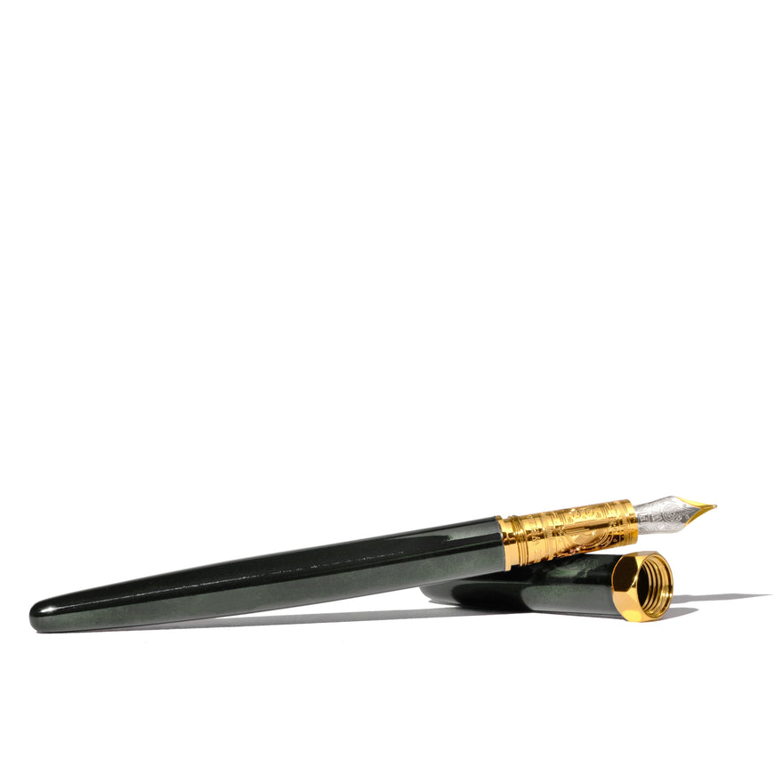 The Bijou Fountain Pen - Echoes of Eaton (Fine) by Ferris Wheel Press, showcases a glossy body with a gold-highlighted nib and cap ring, cap beside.
