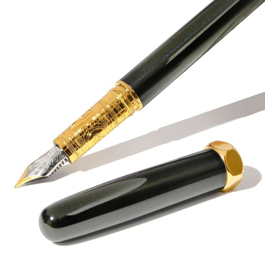 The Bijou Fountain Pen - Echoes of Eaton (Fine) by Ferris Wheel Press, featuring a gold-engraved grip, two-tone nib, and glossy black cap with gold accents.