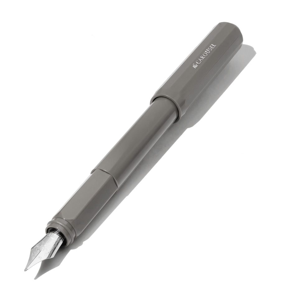 Carousel Fountain Pen - Granite Guardians (Fine) by Ferris Wheel Press, featuring a grey octagonal plastic body and uncapped custom-ground steel nib, ideal for nuanced writing.