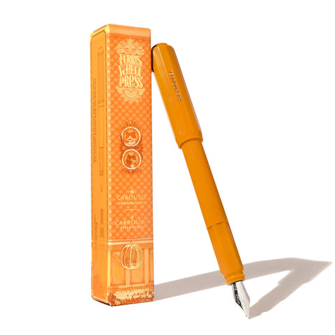 Ferris Wheel Press Carousel Fountain Pen - Hearty Harvest (Medium), features a bright orange body with stainless steel nib, accompanied by its matching box with harvest motif.