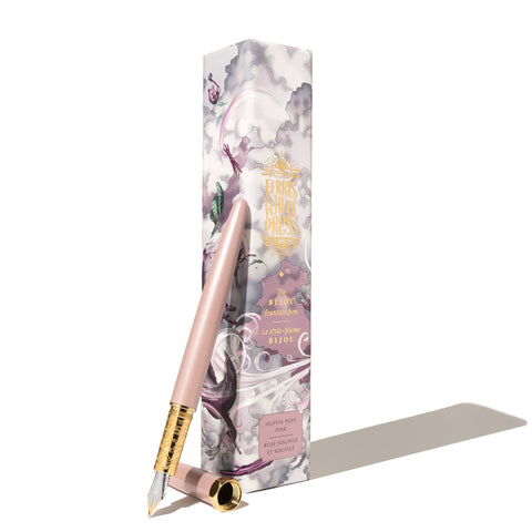 Ferris Wheel Press Bijou Fountain Pen - Huffin Puff Pink (Fine) with exposed gold-trimmed section and steel nib, leaning against its decorative box.