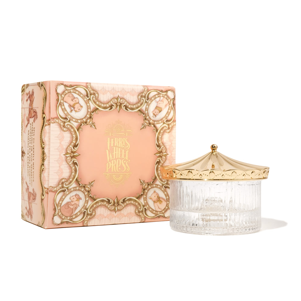 Ferris Wheel Press Carousel Inkwell - Sunset Gold: Decorative peach-and-gold box with a clear ribbed glass jar, featuring a carousel-style gold lid, perfect for blending fountain pen ink.