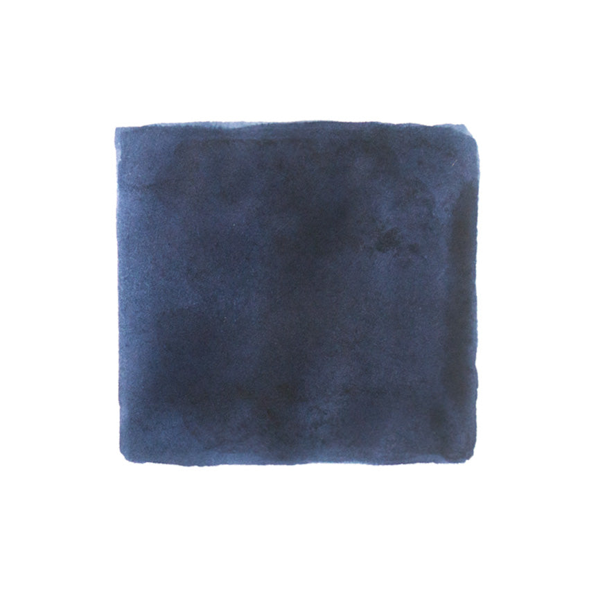 KWZ Ink IG Blue Black fountain pen ink, 60ml bottle, showcased on dark-navy plush fabric background, highlighting its unique iron gall composition and rich color depth.