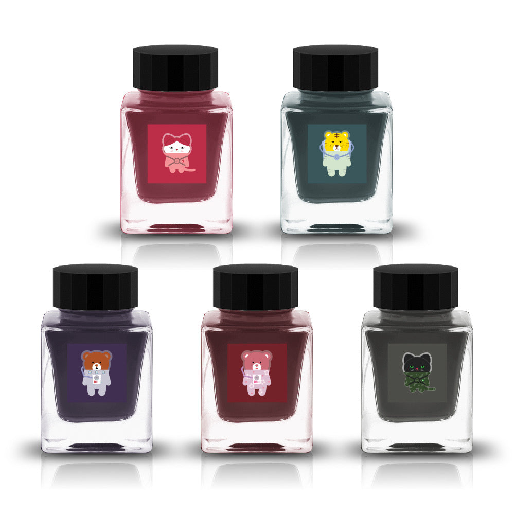 Tono & Lims Gachapon Series Season 6 fountain pen ink bottles featuring five colorful inks, each with a different illustrated animal character on the label, including a cat, tiger, and three bears in astronaut outfits