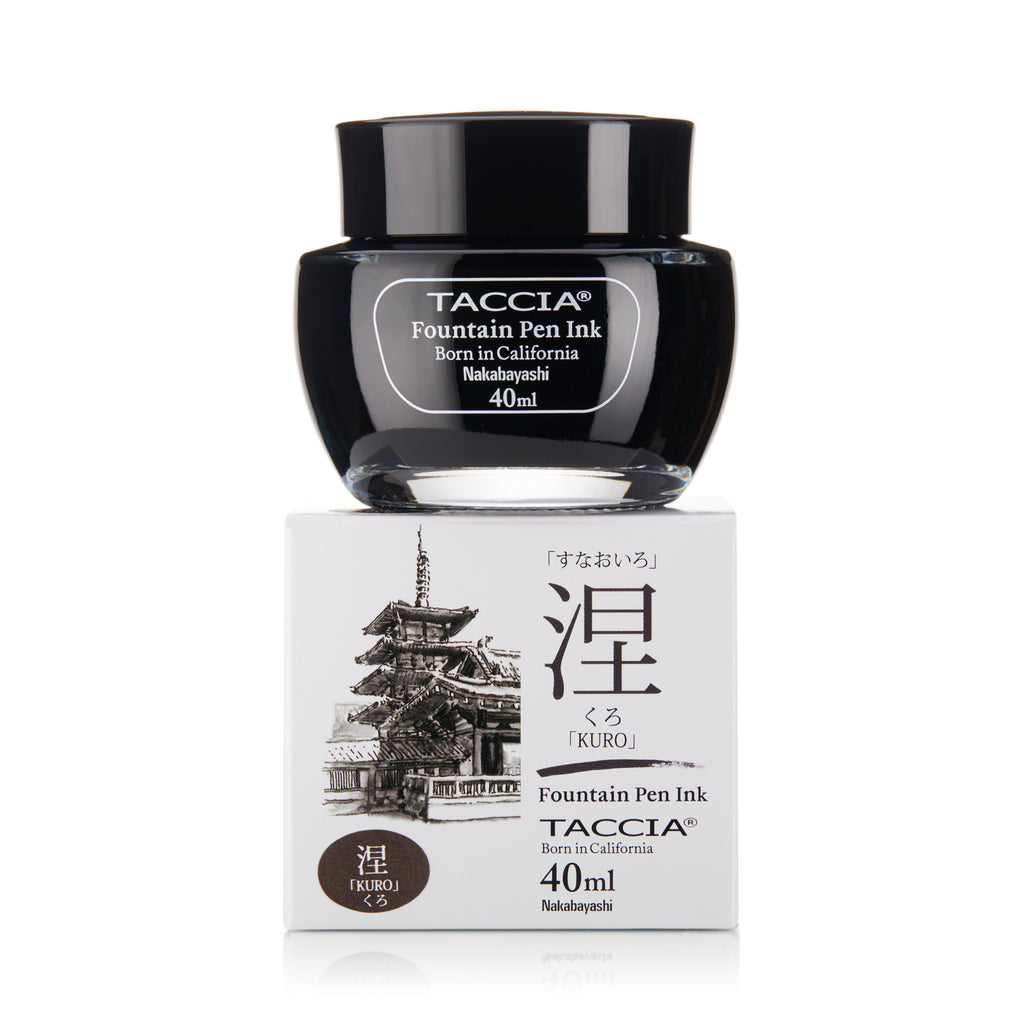 Kuro - 2ml Taccia ink sample in a glass bottle on its box featuring Japanese pagoda art and bilingual name, suitable for resin and celluloid pens.