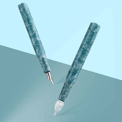 Moonman N6 Glass Pen and Nib Set features a teal-marbled fountain pen with stainless-steel nib and a calligraphy pen with white-bristle brush, showcasing elegant design and versatility.