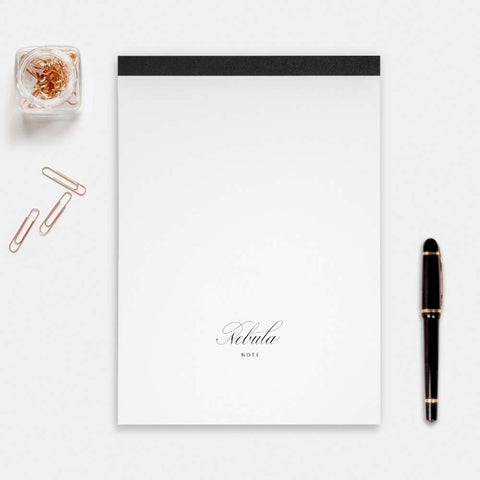 Nebula Tomoe River Writing Pad 100 Sheets - Blank (X-Large) with black binding, paired with a black fountain pen and rose-gold paper clips, ideal for fountain pen users.