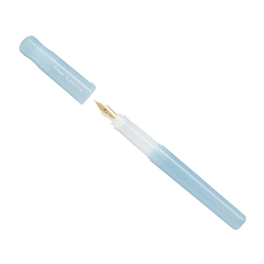 Pilot Kakuno Madoromi fountain pen, light blue, medium nib, with exposed gold-colored nib, showcasing its plastic body and durable stainless steel construction.