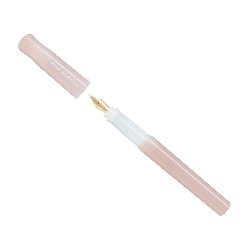 Pilot Kakuno Madoromi - Pink - Fine (LE) fountain pen with gold-tone nib, cap removed. Limited edition starter pen with durable stainless steel nib.