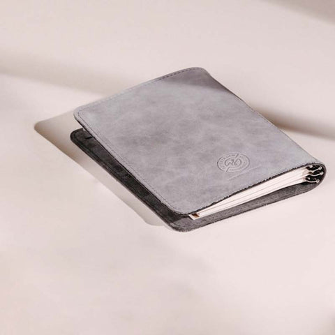 Taschenbegleiter SO_20 - Light Grey/Grey (M) by Roterfaden, a light grey folio with visible paper inserts, ideal for organizing loose papers and notebooks.