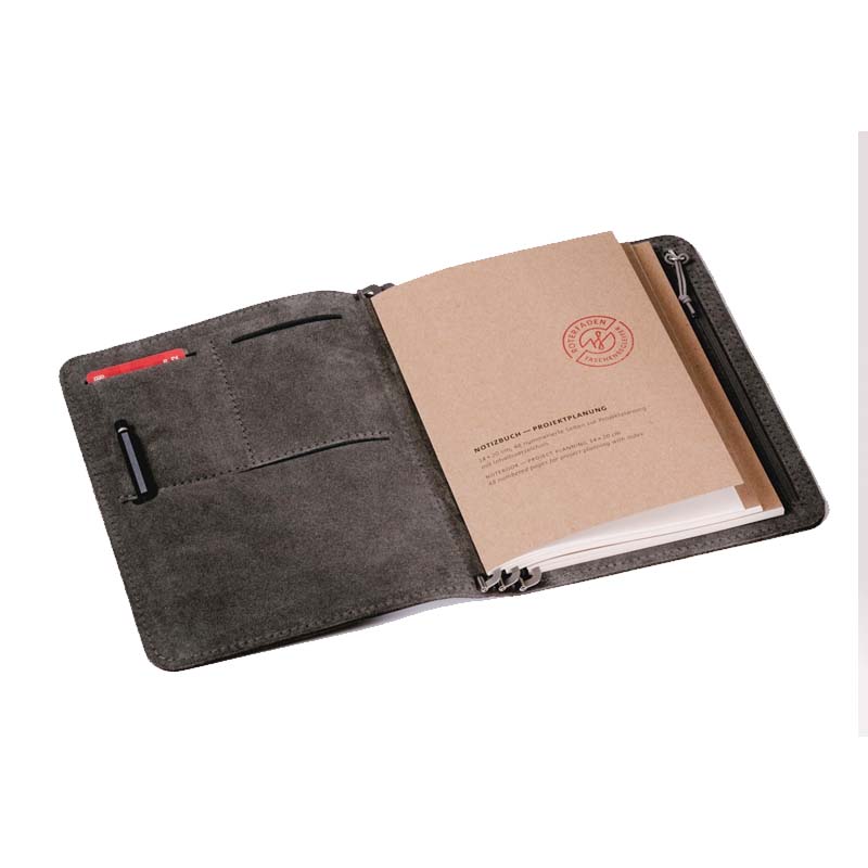 Roterfaden Taschenbegleiter SO_20 portfolio organizer in dark grey suede holds a kraft-paper notebook, card slots, and pen loop, ideal for fountain pen-friendly planning.