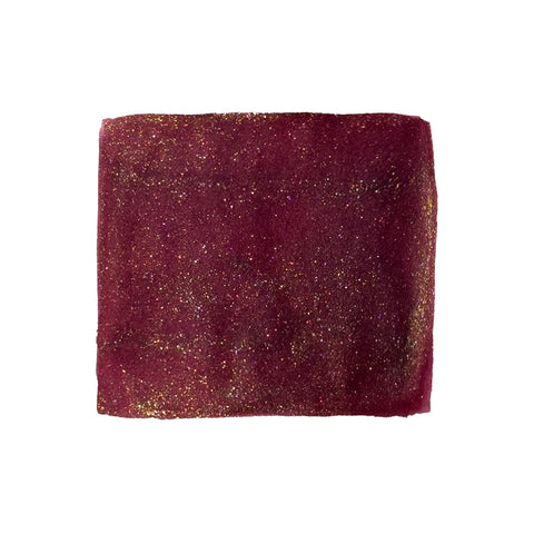 Ferris Wheel Press The King Midas - Ambrosia Indulgence fountain pen ink, 85ml, in a deep red glitter-coated scrunchie.