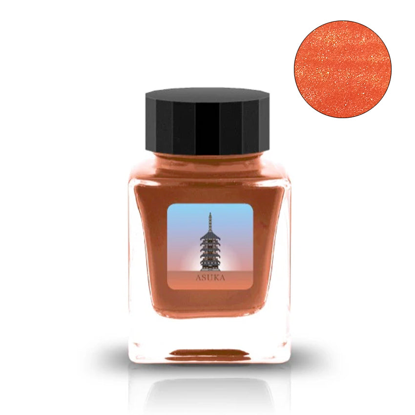 Asuka - 2ml ink sample in a square glass jar with black lid, featuring shimmery burnt-orange liquid and metallic orange-copper sparkle, by Tono & Lims.