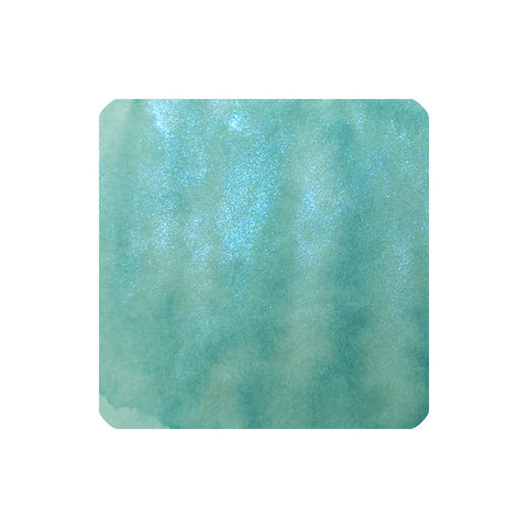 Dominant Industry Atlantis (Archival, Shimmer) fountain pen ink, 25ml, showcases a teal-green watercolor wash with a subtle pearlescent shimmer, ideal for vibrant writing.