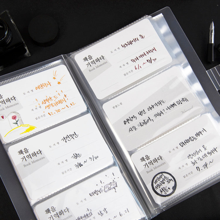 Wearingeul Ink Swatch Card Binder with clear sleeves holds “Book Memories” cards for cataloging fountain pen ink, featuring fields for book details and personal notes.