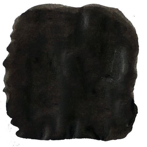 Noodler's Black - 2ml ink swatch, showing an abstract black smear on white, representing the rich dye-based, archival ink's vivid application.