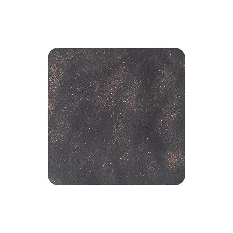 Blood Stone (Shimmer) - 30ml by Tono & Lims: Close-up of shimmering black granular fountain pen ink with rainbow sparkles, ideal for vibrant writing.