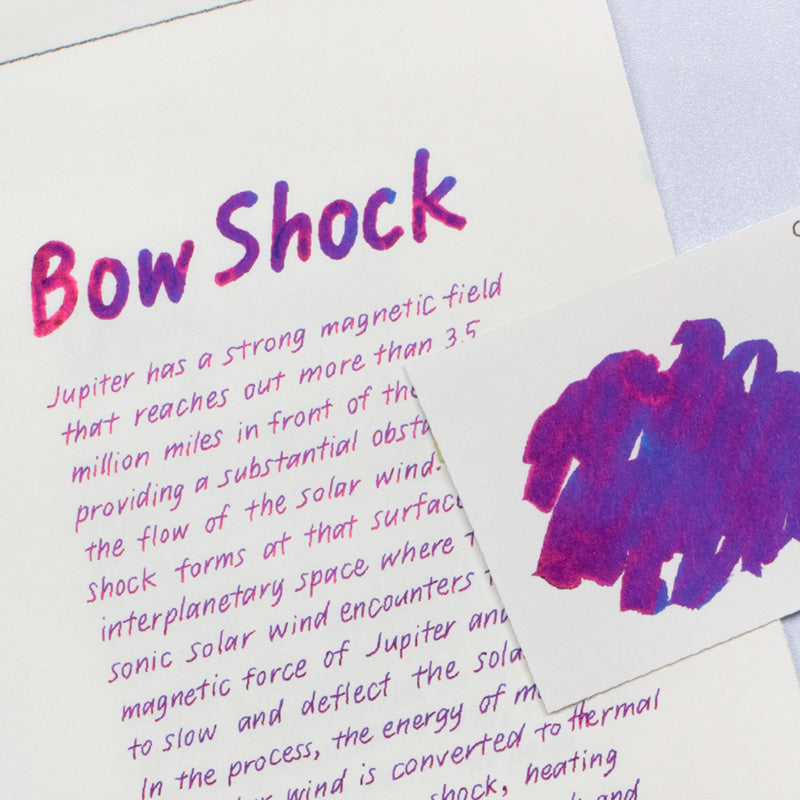 Colorverse Bow Shock & Intense Magnetic Field fountain pen ink set, featuring a purplish-pink ink sample card with Jupiter's bow shock description, includes 65ml and 15ml bottles.