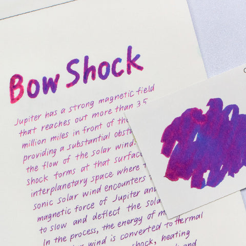 Colorverse Bow Shock & Intense Magnetic Field fountain pen ink set, featuring a purplish-pink ink sample card with Jupiter's bow shock description, includes 65ml and 15ml bottles.