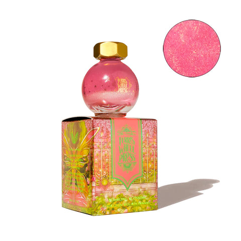 Once Upon a Time - Bumbling Blossom - 20ml shimmering fountain pen ink by Ferris Wheel Press, in a globe-shaped glass bottle with gold cap, atop decorative box.