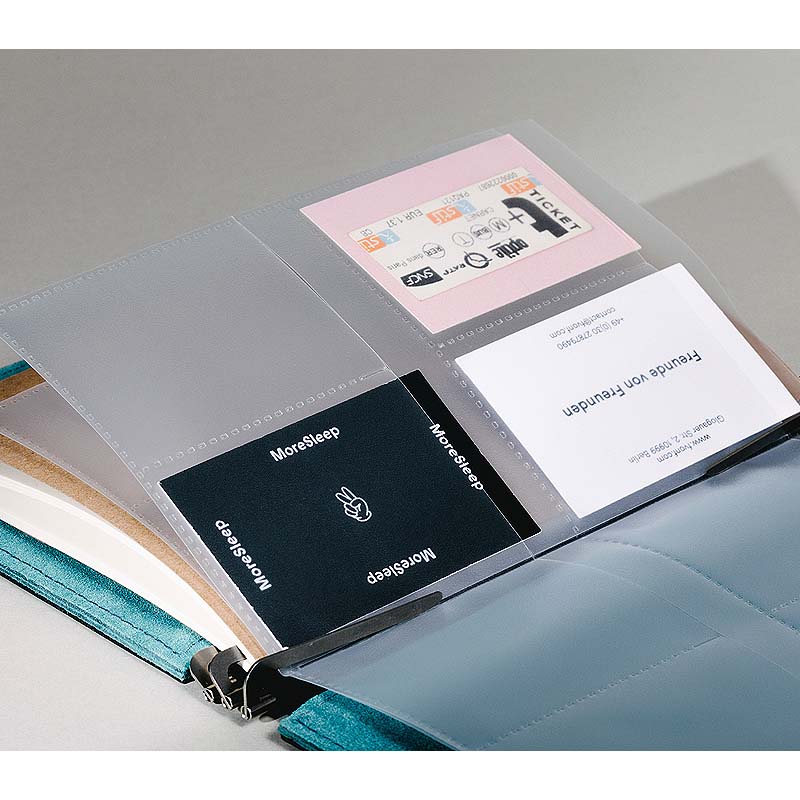 Roterfaden Business Card Protectors (2 Pack) in a teal ring-binder, showcasing clear sleeves with a pink ticket stub, business card, and MoreSleep card, highlighting versatile card storage.