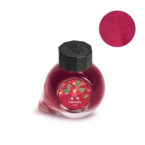 Colorverse Project Ink No.063 Camellia - 15ml bottle featuring camellia blossoms on label, represents rich, rosy-red fountain pen ink for creative writing and artistry.