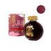 Candy Marsala - 85ml bottle; globe-shaped glass with brass cap, gold logo, in a deep red illustrated box, includes ink color swatch.