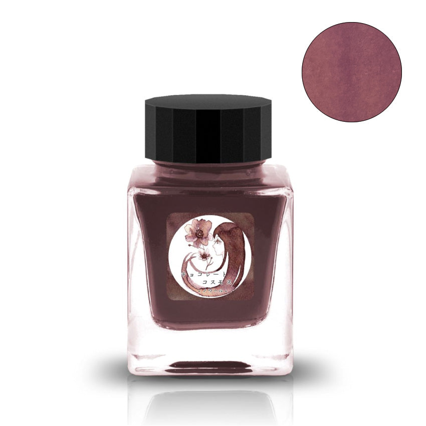 Chocolate Cosmos Noir fountain pen ink by Tono & Lims, 30ml. Features deep brown-reddish hue, stylized label with a woman's profile and cosmos flower.