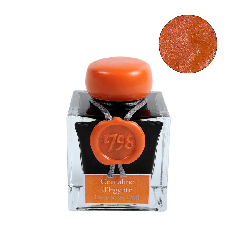 Jacques Herbin Cornaline d'Égypte (1798 Collection) fountain pen ink, 50ml square glass bottle with orange wax cap and label, shimmering warm carnelian-orange color swatch included.