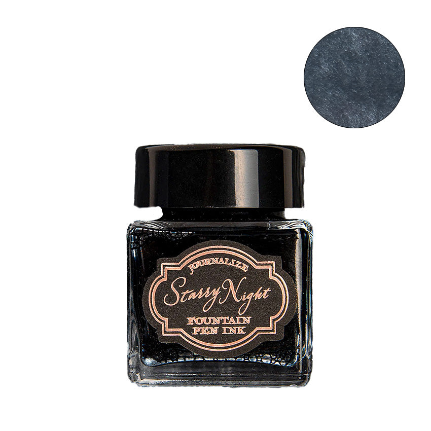 Journalize Cosmic City shimmering fountain pen ink, 30ml bottle, with deep charcoal-blue hue and metallic shimmer, ideal for Desk Bandit's fountain pen enthusiasts.