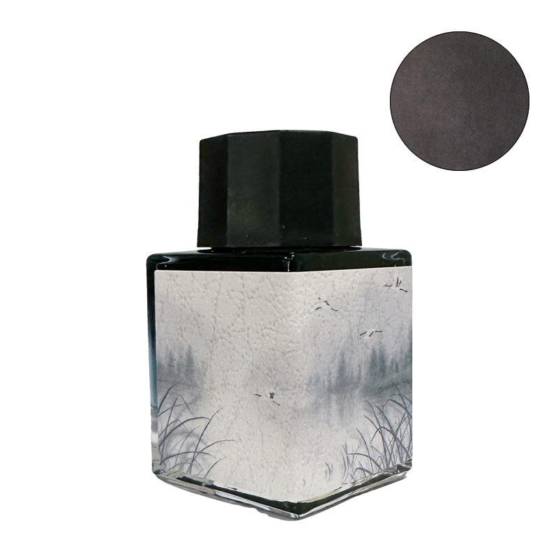 Fanyantan Crane's Shadow fountain pen ink, 20ml, in a square glass bottle with a black cap and decorative landscape label, showcasing its charcoal hue.