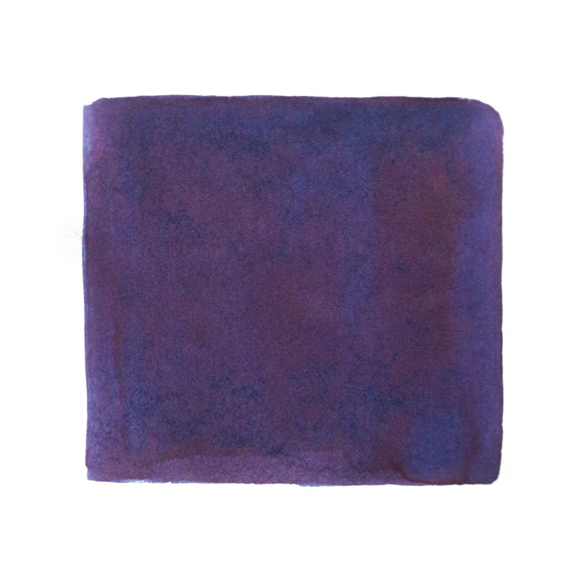 Sailor Date Gokoro fountain pen ink in deep purple, 20ml bottle, showcasing its unique color shift potential on Tomoe River paper.