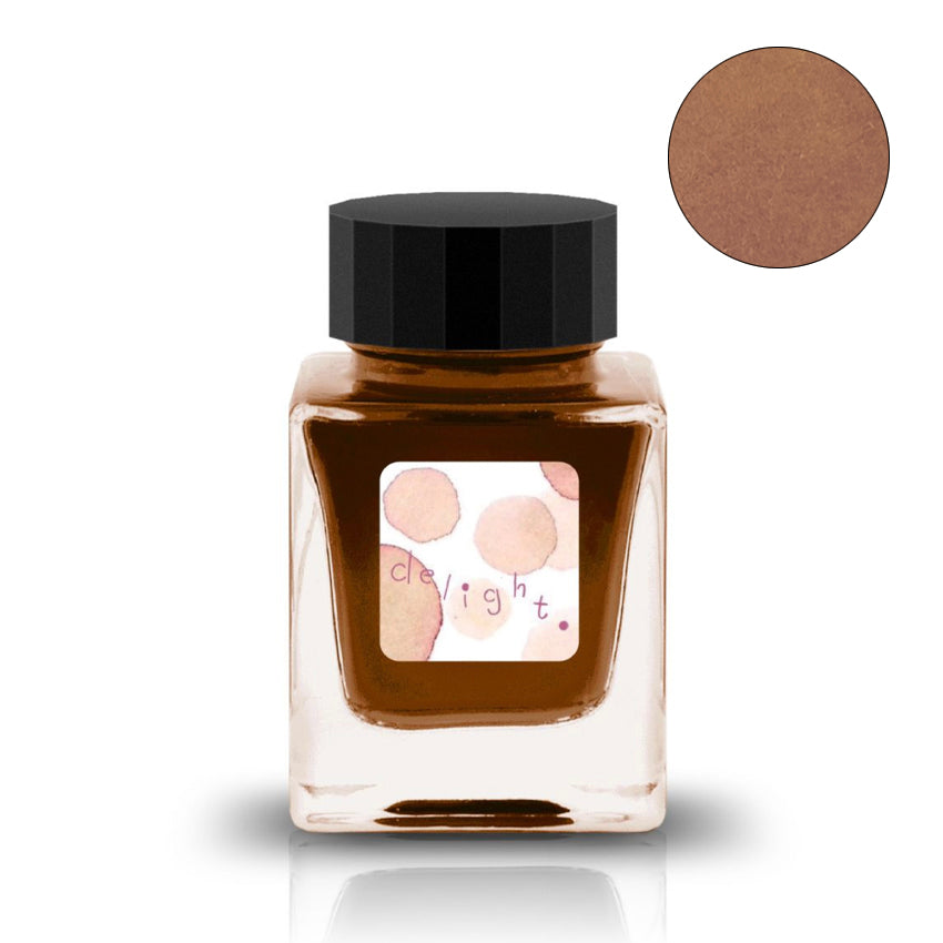 30ml jar of Tono & Lims delight ink, featuring an earth orange-brown hue, with a decorative label and matching color swatch.