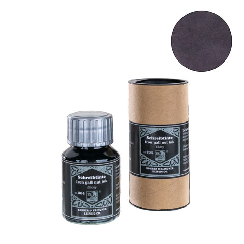 Ebony (2023 Edition) fountain pen ink by Rohrer & Klingner, 50ml, in glass bottle with cylindrical storage tube; features deep ebony-black color.