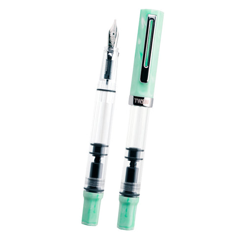 TWSBI ECO (Amazonite) - Extra Fine fountain pens, featuring clear barrels and mint-green marbling, showcasing a piston-filling mechanism and stainless-steel nib.