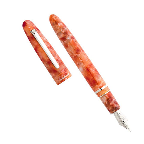 Esterbrook Estie - Petrified Forest fountain pen with palladium trim, featuring a journaling nib. Cap removed and placed alongside, showcasing its orange-peach marbled resin body.