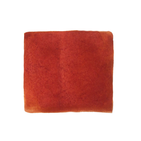 KWZ Ink Flame Red fountain pen ink, 60ml, featuring a textured swatch, exemplifies Desk Bandit's unique writing supplies, combining handcrafted quality with distinctive color.