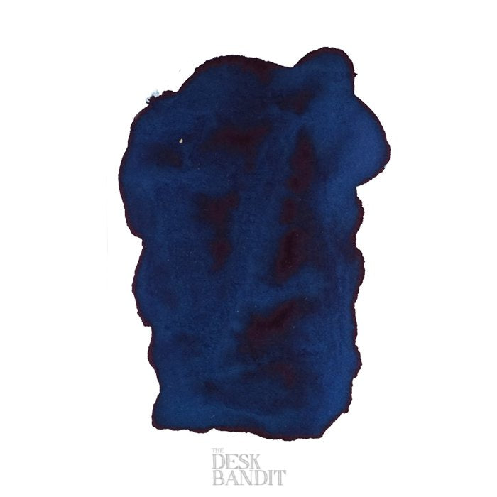 Frankly Blue - 2ml ink sample, showcasing dark-blue swatch with watery edges on white paper, featuring THE DESK BANDIT watermark at the bottom.