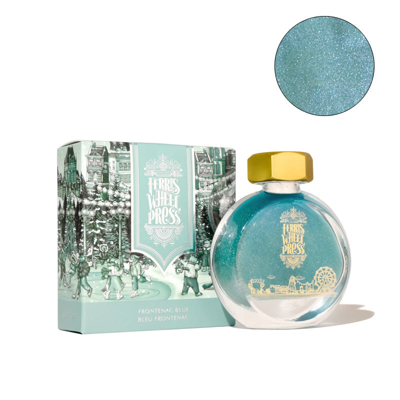 Ferris Wheel Press Frontenac Blue (Shimmer) - 38ml fountain pen ink in a round glass bottle with gold cap, showcased alongside its decorative winter scene box.