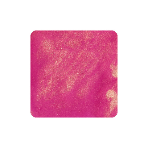 Jacques Herbin Fuchsia de Magellan fountain pen ink, shimmering bright pink, 50ml, from the 1670 Collection. Close-up of granular, metallic-flecked texture.
